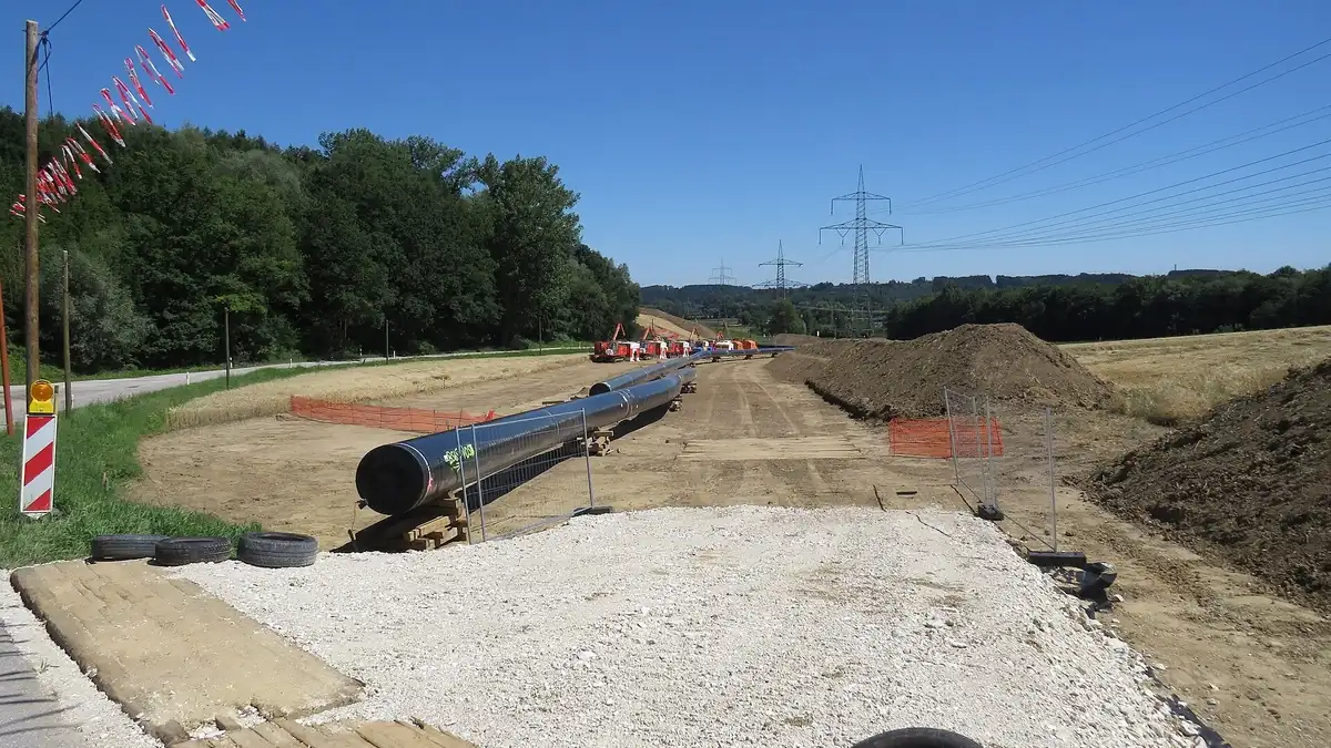 Gas pipeline under construction across farmland, the kind of network that links multiple hydrogen sites