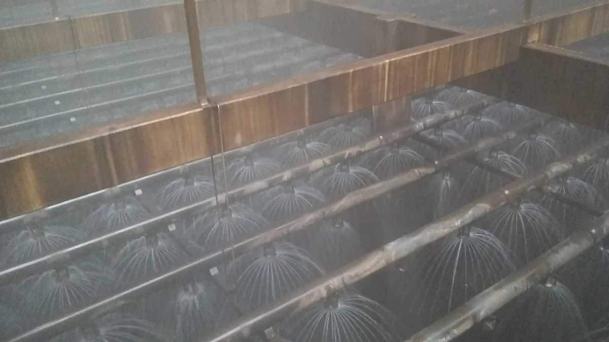 Inside an industrial cooling tower, one of the site utilities an electrolyser installation relies on