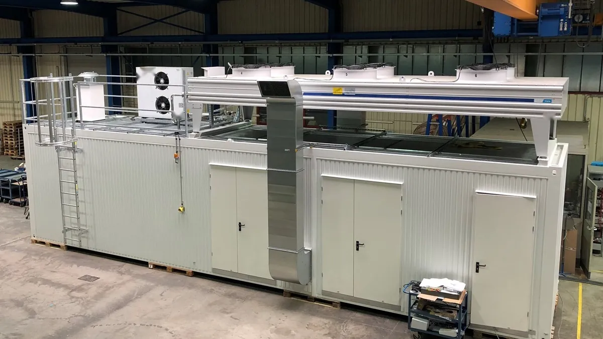 PEM electrolyser system enclosure in a factory hall before long-term operation