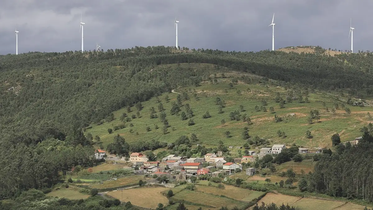 Wind farm on a ridge above a valley, a variable power source that electrolysers must follow dynamically